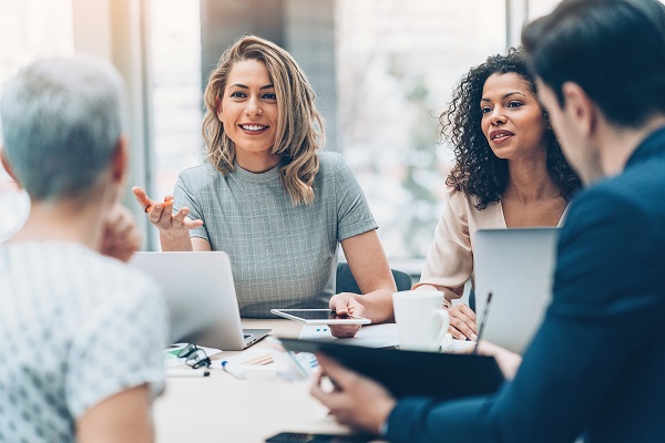 Professionals gathered around conference table